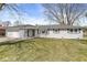 Charming single-story home with a well-maintained lawn and attached two car garage at 1710 Bittersweet Dr, Anderson, IN 46011