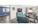 Open-concept living room with gray walls, modern furnishings, and lots of natural light at 1710 Bittersweet Dr, Anderson, IN 46011
