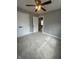 Spacious bedroom with carpet flooring, ceiling fan, and closet doors at 1746 Lambert St, Indianapolis, IN 46221