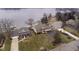 Aerial view highlighting the home's prime waterfront location, manicured lawn, and neighborhood setting at 2005 Dakota Dr, Noblesville, IN 46062