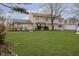 Expansive backyard featuring a well-maintained lawn and mature trees for privacy and shade at 2005 Dakota Dr, Noblesville, IN 46062