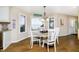Breakfast nook with lake views, a modern chandelier and a wood-look floor at 2005 Dakota Dr, Noblesville, IN 46062