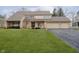 Well-maintained home with a lush green lawn and a three-car garage at 2005 Dakota Dr, Noblesville, IN 46062