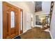 Inviting foyer with hardwood floors, a staircase, and a decorative front door at 2005 Dakota Dr, Noblesville, IN 46062