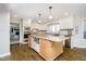 Spacious kitchen featuring an island with granite countertops and stainless steel appliances at 2005 Dakota Dr, Noblesville, IN 46062