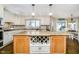 Gourmet kitchen features large island, granite countertops, custom cabinetry and built in wine rack at 2005 Dakota Dr, Noblesville, IN 46062