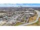 A sweeping aerial view captures a neighborhood and its proximity to the city skyline at 2023 Shelby St, Indianapolis, IN 46203