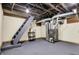 Unfinished basement with utilities, stairs, and painted floor at 2023 Shelby St, Indianapolis, IN 46203