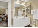 Bathroom featuring a double vanity and built-in storage shelves at 2023 Shelby St, Indianapolis, IN 46203