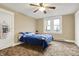 Bedroom with sports memorabilia, carpet, and large window at 2023 Shelby St, Indianapolis, IN 46203