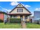 Charming two-story home featuring a well-maintained lawn and a classic design at 2023 Shelby St, Indianapolis, IN 46203