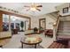 Spacious living room with vintage decor, stairs and entry to the office at 2023 Shelby St, Indianapolis, IN 46203