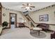 Comfortable living room with traditional decor, stairs, and a view of the kitchen at 2023 Shelby St, Indianapolis, IN 46203