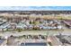 An aerial view of a neighborhood includes houses, roads and a highway in the distance and city skyline at 2023 Shelby St, Indianapolis, IN 46203