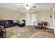 Room with carpet, ceiling fan, and furniture at 2023 Shelby St, Indianapolis, IN 46203