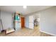 Unfinished basement area featuring modern flooring, utility connections, and access to the kitchen at 220 Monroe St, Indianapolis, IN 46229