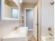 Updated bathroom with a modern vanity, subway tile shower, and updated fixtures at 220 Monroe St, Indianapolis, IN 46229