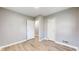 Bright bedroom featuring modern flooring, neutral walls, and ample closet space at 220 Monroe St, Indianapolis, IN 46229
