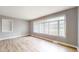 Bright living room featuring neutral paint, wood floors, and lots of natural light at 220 Monroe St, Indianapolis, IN 46229