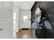 Stylish entryway featuring a modern console table, mirror, and decorative paneling at 2212 Boxwood Dr, Greenfield, IN 46140