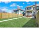 Expansive backyard with lush green grass, walkway, and patio dining area, great for gatherings at 2352 N College Ave, Indianapolis, IN 46205