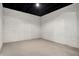 Unfinished basement with painted brick walls, concrete floor and exposed ceiling at 2352 N College Ave, Indianapolis, IN 46205