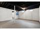 Unfinished basement with exposed ceiling, painted walls, and concrete floor at 2352 N College Ave, Indianapolis, IN 46205