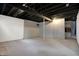 Unfinished basement space with painted walls, concrete floor, and exposed ductwork at 2352 N College Ave, Indianapolis, IN 46205