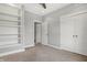 This bedroom has neutral colored carpet, built-in shelving and a double door closet at 2352 N College Ave, Indianapolis, IN 46205