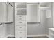 Walk-in closet with custom built-in shelving and drawers, maximizing storage space at 2352 N College Ave, Indianapolis, IN 46205