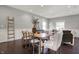 Dining room with hardwood floors, and modern lighting that connects to the living room and kitchen at 2352 N College Ave, Indianapolis, IN 46205