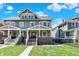 Charming two-story home featuring a welcoming front porch and well-maintained lawn with lovely landscaping at 2352 N College Ave, Indianapolis, IN 46205