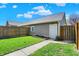 Detached garage with a clean design and a well-maintained lawn surrounding it at 2352 N College Ave, Indianapolis, IN 46205
