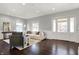 Spacious living room featuring hardwood floors, recessed lighting, and bright windows at 2352 N College Ave, Indianapolis, IN 46205