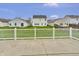 Fenced backyard with green lawn and patio at 2468 Shadow Bend Dr, Columbus, IN 47201