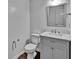 Bathroom featuring white fixtures, vanity with marble countertop, and modern fixtures at 2468 Shadow Bend Dr, Columbus, IN 47201