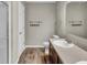 Clean bathroom featuring a sink, toilet, shower, and ample lighting at 2468 Shadow Bend Dr, Columbus, IN 47201
