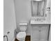 Bathroom featuring white fixtures, vanity with marble countertop, and modern fixtures at 2468 Shadow Bend Dr, Columbus, IN 47201