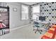 Bedroom with unique geometric wallpaper, a workstation, a chair, and a view through the windows at 2468 Shadow Bend Dr, Columbus, IN 47201