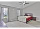 Spacious bedroom with neutral walls, ceiling fan, and bright windows at 2468 Shadow Bend Dr, Columbus, IN 47201