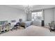 Bonus room with carpet, chandelier, desk and bed at 2468 Shadow Bend Dr, Columbus, IN 47201