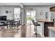 Open-concept floorplan with stainless steel appliances and a dining area with table and chairs at 2468 Shadow Bend Dr, Columbus, IN 47201