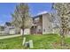 Attractive home with brick accents and blossoming trees in the front yard creates curb appeal at 2468 Shadow Bend Dr, Columbus, IN 47201