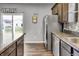Modern kitchen with stainless steel appliances and sliding door to backyard at 2468 Shadow Bend Dr, Columbus, IN 47201