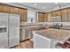 Kitchen featuring stainless steel appliances, stone countertops, and ample cabinet space at 2468 Shadow Bend Dr, Columbus, IN 47201