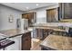 Kitchen featuring stainless steel appliances, stone countertops, and ample cabinet space at 2468 Shadow Bend Dr, Columbus, IN 47201