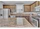 Kitchen featuring stainless steel appliances, stone countertops, and ample cabinet space at 2468 Shadow Bend Dr, Columbus, IN 47201