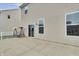 Relaxing backyard patio with swing and view of the home's exterior at 2468 Shadow Bend Dr, Columbus, IN 47201