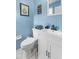Charming bathroom with blue walls and modern fixtures, creating a relaxing atmosphere at 2539 S Edgewood Cv, Martinsville, IN 46151