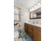 Bright bathroom features marble countertop, wooden cabinets, and a charming window at 2539 S Edgewood Cv, Martinsville, IN 46151